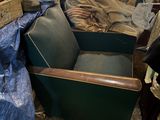 a chair that is sitting in a room with a lot of stuff