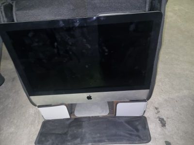 a computer monitor sitting on top of a desk