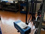a photo of a room with a lot of tools on the floor