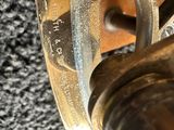 a close up of a brass clock with a clock face on it