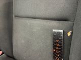 a close up of a car seat with a ruler on the back of it