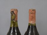 bottles of wine with a bird on the top and a bird on the bottom