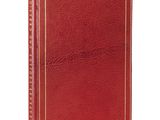 a red leather book with a gold trim