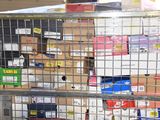 a metal cage filled with lots of boxes and papers