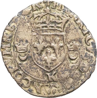 a close up of a coin with a crown on top of it