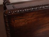 a bed with a wooden headboard and foot board