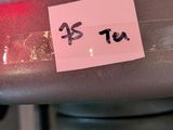 a sticker on the handlebar of a bicycle with a red light
