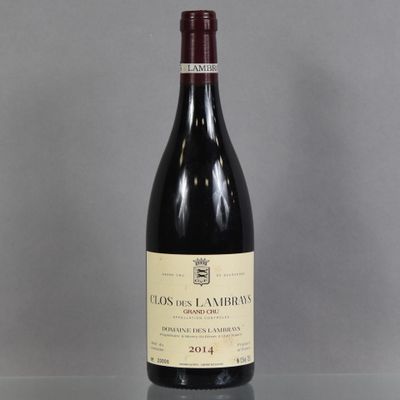 a bottle of wine that is sitting on a table