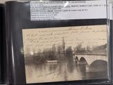 a black and white photo of a bridge over a river