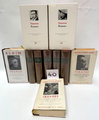 several books are stacked on top of each other on a table