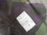 a close up of a military jacket with a label on it
