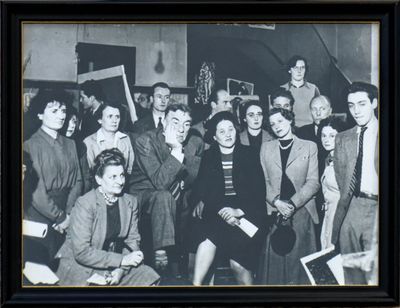 black and white photograph of a group of people posing for a picture