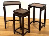 three wooden tables sitting on top of a hard wood floor