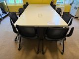 a long table with chairs around it in a room