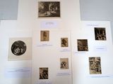 a lot of pictures on the wall of this room