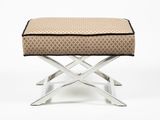 an upholstered foot stool with a cushion on top of it