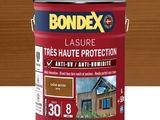 un gros plan d'un pot de peinture au latex Bondex posé sur une table