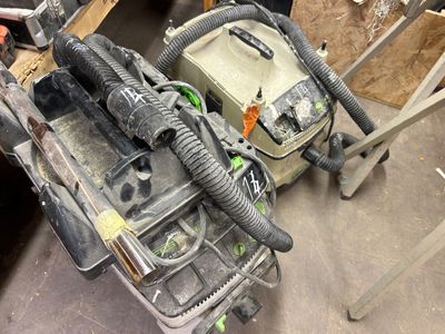 an image of a tool bag and a vacuum on a table
