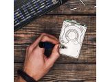 a man that is drawing a picture on a piece of paper