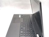 a laptop that is open on a white surface