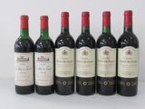 six bottles of wine are lined up in a row on a table