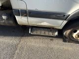 a truck that is parked on the side of the road