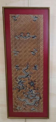 a picture of a picture of a dragon on the wall