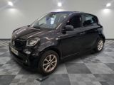 a picture of a smart car in a showroom