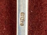 a spoon that is sitting on a red carpet