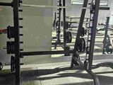 a gym with a lot of equipment in the room