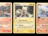 three pokemon cards are shown in a row on a black background