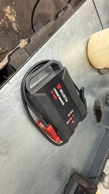 an image of a man using a power tool on a metal surface