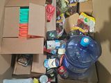 a cardboard box filled with food and a bottle of water