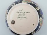 a blue and white vase with writing on it
