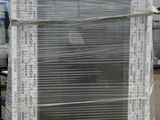 a stack of old windows sitting on top of a pallet