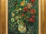 painting of a vase of flowers in a gold frame on a green background
