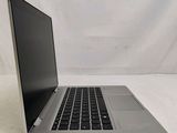an open laptop computer sitting on top of a white surface