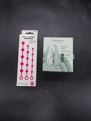 a box of toothbrushes and a box of toothpaste on a table