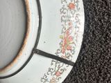 a cup of coffee sitting on a saucer on the floor