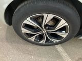 a close up of a tire on a car ' s rim