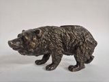 statue of a brown bear on a white background