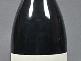 a bottle of wine that is sitting on a table