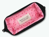 the pink and black case is filled with a pink flower pattern