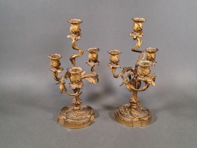 pair of antique brass candelabs with flowers and leaves