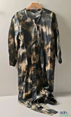 an image of a brown and black tie dyed shirt on a hanger
