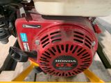 a close up of a small engine on a pallet
