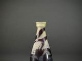 a black and white vase sitting on top of a table