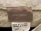 the label on the back of a longchampp dress shows that it is made in france