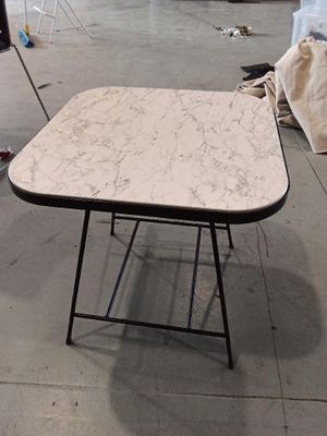 a table that is sitting on the floor in a room