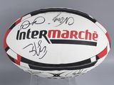 an image of a white and black soccer ball with a red and black stripe